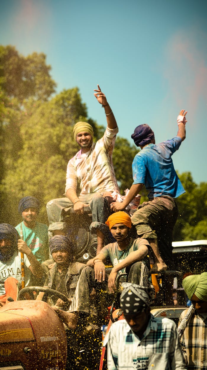 A group of people riding on top of a truck